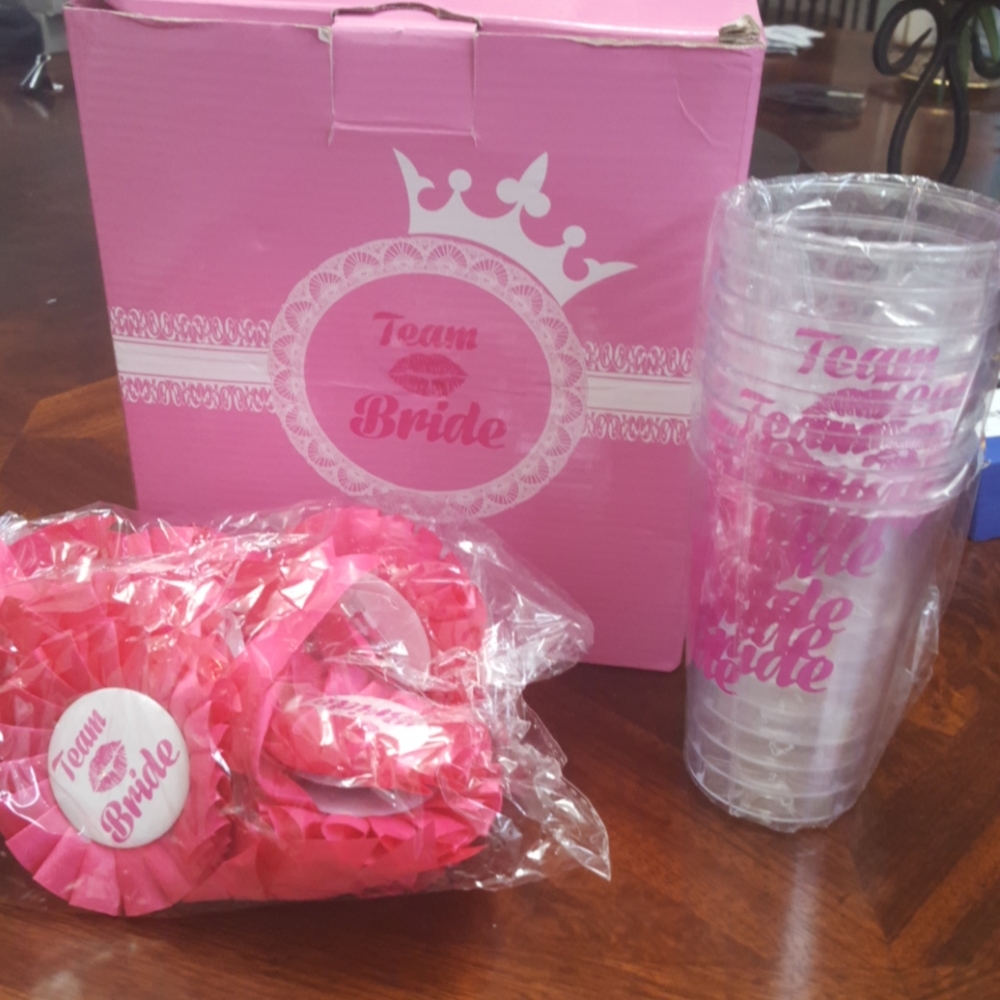 Team bride. Cups and lapel pins.